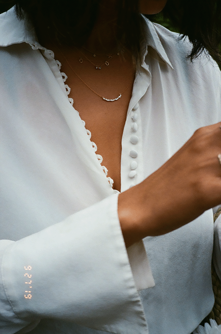A close-up of a diamond necklack on Siffat's neck. Shot on 35mm film.