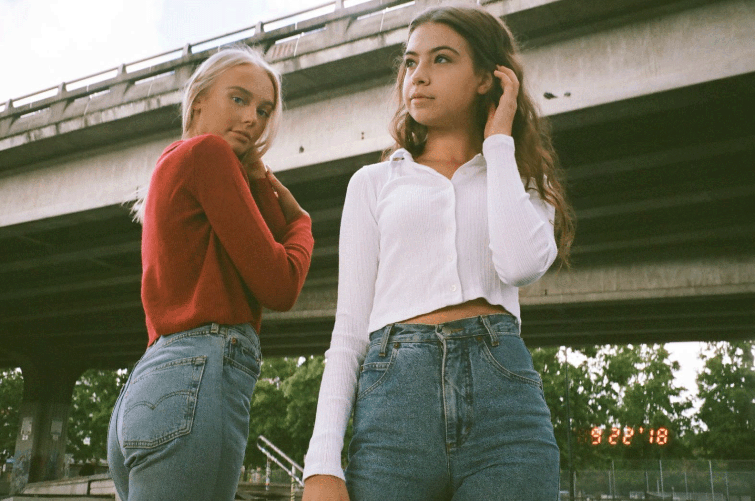 Two girls standing underneath an overpass in Vancouver. Shot on 35mm film. 