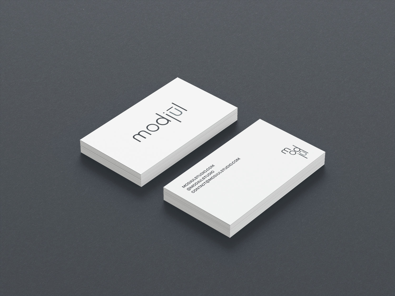 A mockup of the modjūl business cards designed by Aprille.